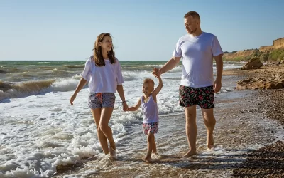 a family at the beach enjoying the summer