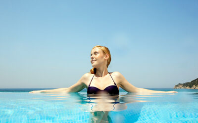 woman in a pool on a hot sunny day